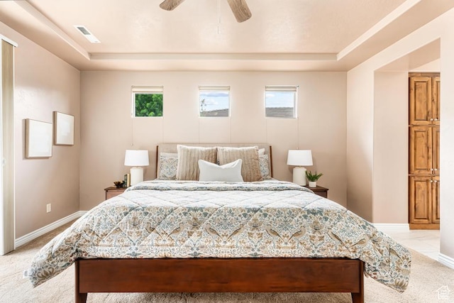8 S Arroyo Dr, St George, UT 84790 - bedroom featuring a raised ceiling, baseboards, and light carpet