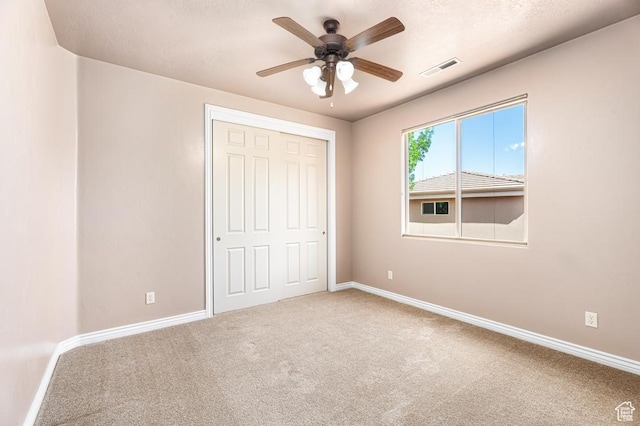 8 S Arroyo Dr, St George, UT 84790 - unfurnished bedroom with carpet, baseboards, a closet, and a ceiling fan