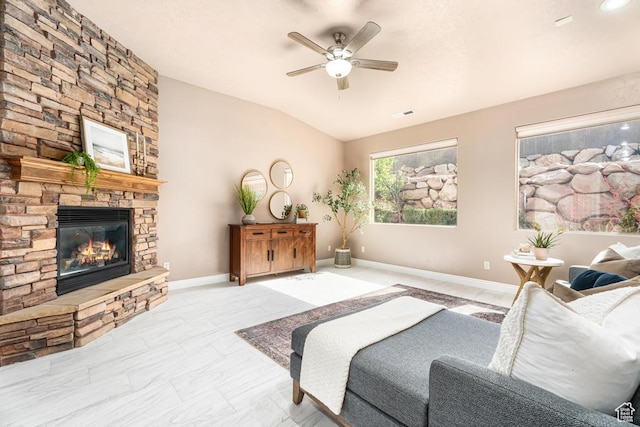 8 S Arroyo Dr, St George, UT 84790 - bedroom featuring lofted ceiling, a stone fireplace, ceiling fan, and baseboards