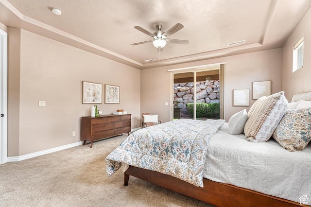 8 S Arroyo Dr, St George, UT 84790 - bedroom with a tray ceiling, access to outside, carpet flooring, baseboards, and a ceiling fan