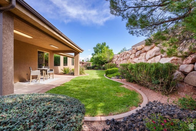 8 S Arroyo Dr, St George, UT 84790 - view of grassy yard with a patio area