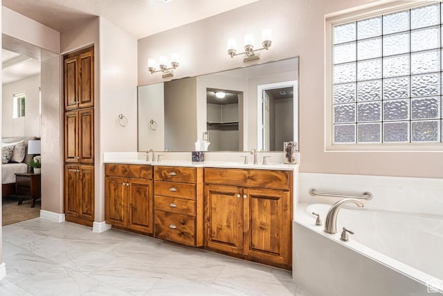 8 S Arroyo Dr, St George, UT 84790 - bathroom with marble finish flooring, a bath, and double vanity