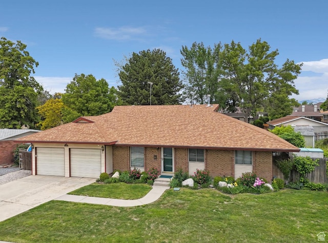 635 E Pioneer Ave S, Sandy, UT 84070 - single story home with concrete driveway, an attached garage, a shingled roof, and brick siding