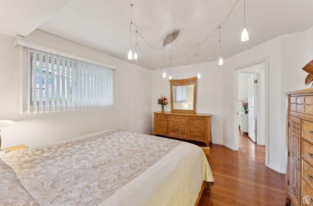 635 E Pioneer Ave S, Sandy, UT 84070 - bedroom featuring wood finished floors and baseboards