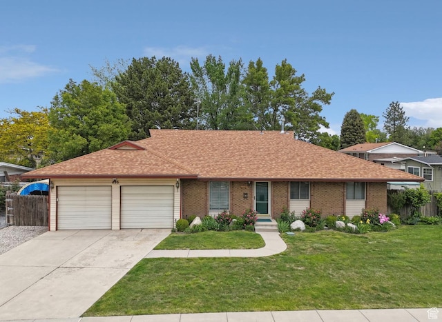 635 E Pioneer Ave S, Sandy, UT 84070 - ranch-style home with an attached garage, concrete driveway, a shingled roof, and brick siding