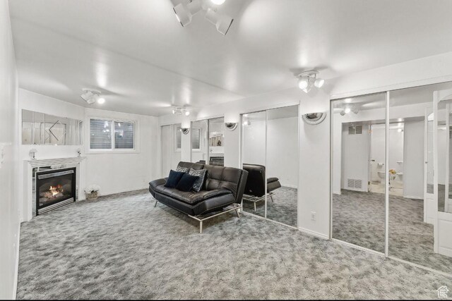 635 E Pioneer Ave S, Sandy, UT 84070 - carpeted living room featuring a glass covered fireplace