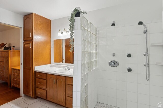 635 E Pioneer Ave S, Sandy, UT 84070 - full bathroom with a tile shower, vanity, and tile patterned flooring