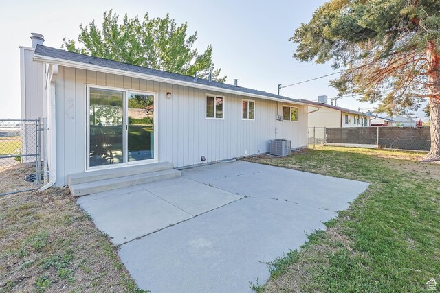 back of property with a patio and board and batten siding