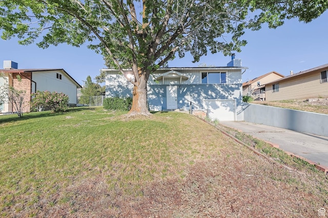 view of front of house featuring concrete driveway and a garage