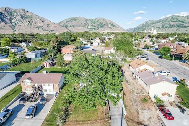 aerial view of residential area featuring mountains