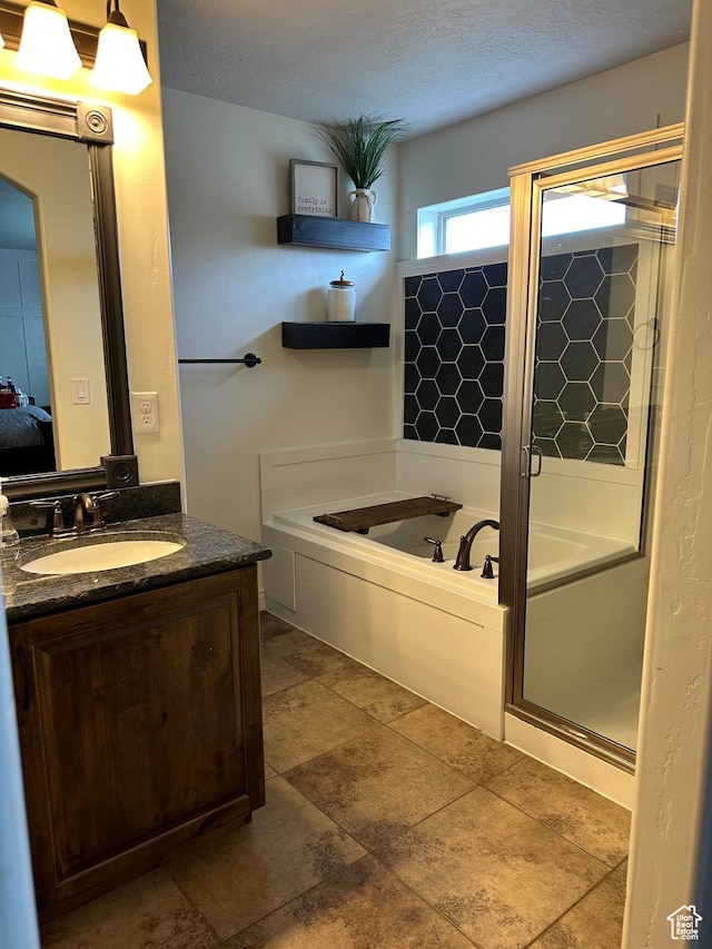 1783 E 2000 S, Naples, UT 84078 - ensuite bathroom with a stall shower, vanity, a bath, and a textured ceiling