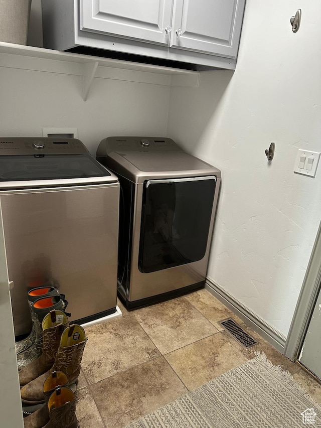 1783 E 2000 S, Naples, UT 84078 - laundry area featuring washer and clothes dryer, cabinet space, and baseboards