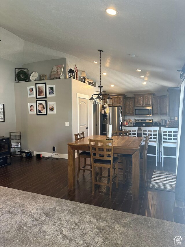1783 E 2000 S, Naples, UT 84078 - dining area featuring dark wood-style floors, a chandelier, recessed lighting, and baseboards