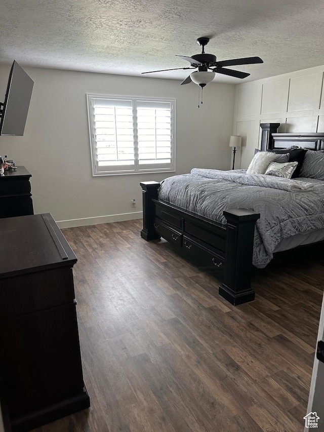 1783 E 2000 S, Naples, UT 84078 - bedroom featuring a textured ceiling, dark wood-type flooring, baseboards, and ceiling fan