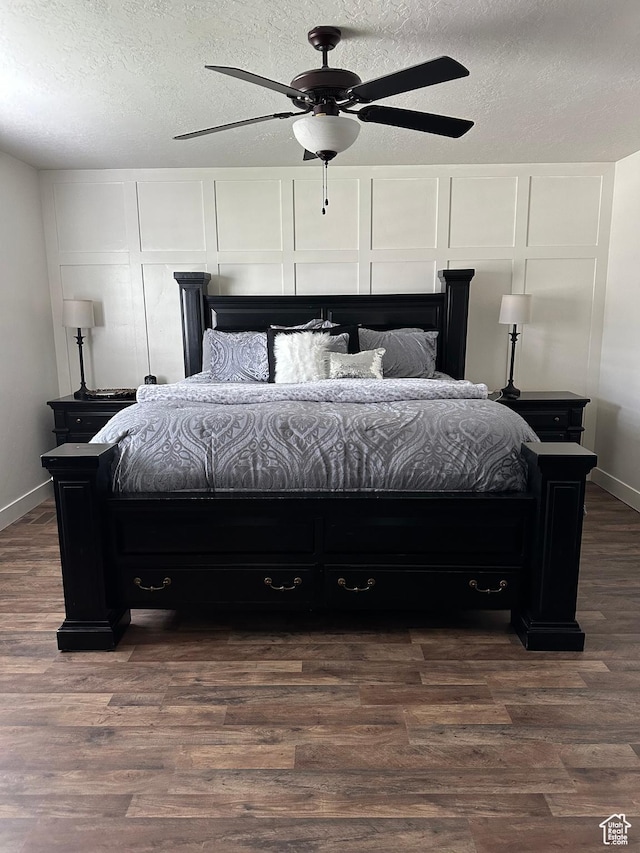 1783 E 2000 S, Naples, UT 84078 - bedroom featuring a textured ceiling, dark wood-type flooring, baseboards, and ceiling fan