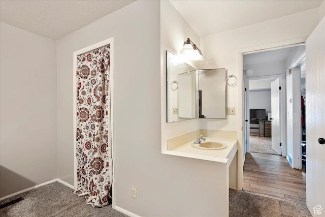 5667 S Aspen Ct E, South Ogden, UT 84403 - bathroom with baseboards and vanity