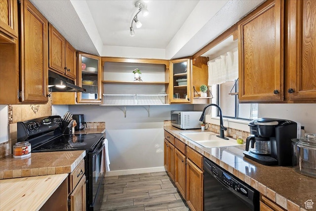 5667 S Aspen Ct E, South Ogden, UT 84403 - kitchen with black appliances, a sink, under cabinet range hood, open shelves, and brown cabinets