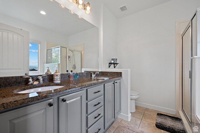 667 W Aspen Hills Blvd N, Saratoga Springs, UT 84045 - full bath with a stall shower, double vanity, toilet, tile patterned flooring, and baseboards