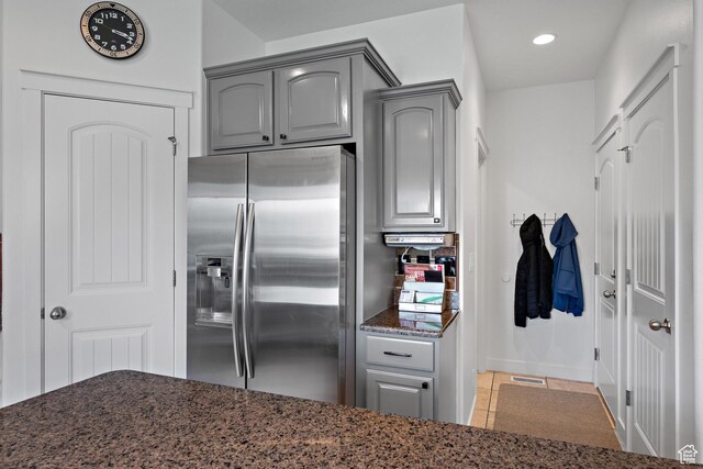 667 W Aspen Hills Blvd N, Saratoga Springs, UT 84045 - kitchen with stainless steel fridge with ice dispenser, gray cabinets, dark stone countertops, recessed lighting, and tile patterned floors