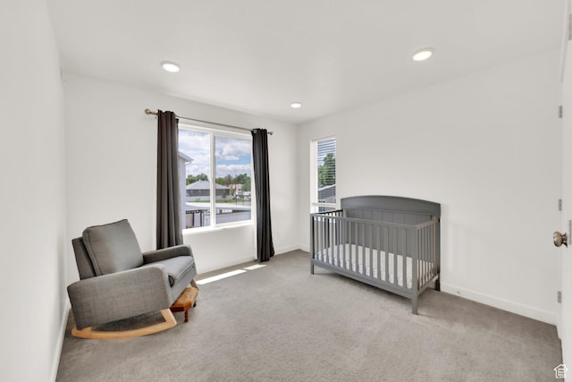 524 E Farmer Alumni Dr S, South Salt Lake, UT 84106 - carpeted bedroom with baseboards, recessed lighting, and a nursery area