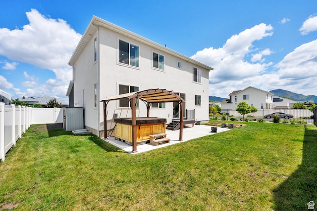 524 E Farmer Alumni Dr S, South Salt Lake, UT 84106 - back of house with a hot tub, a patio, stucco siding, and a residential view