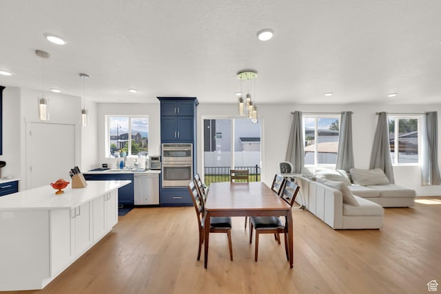 524 E Farmer Alumni Dr S, South Salt Lake, UT 84106 - dining room with light wood finished floors, recessed lighting, and plenty of natural light
