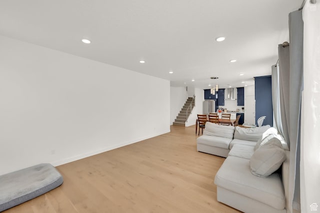 524 E Farmer Alumni Dr S, South Salt Lake, UT 84106 - living room with light wood finished floors, recessed lighting, baseboards, and stairway