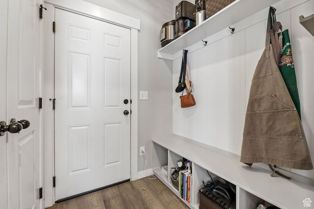 7886 N Bridleway Rd, Eagle Mountain, UT 84005 - mudroom featuring dark wood-type flooring and baseboards