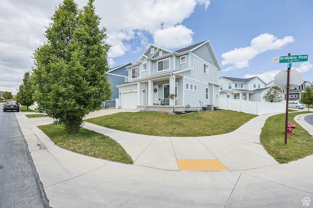 7886 N Bridleway Rd, Eagle Mountain, UT 84005 - multi unit property with board and batten siding, driveway, a garage, and central air condition unit
