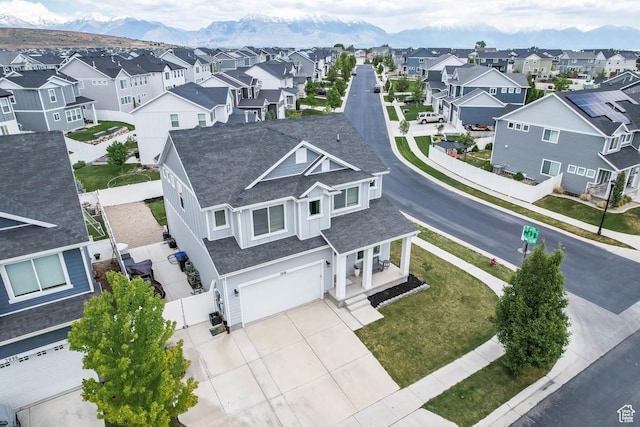 7886 N Bridleway Rd, Eagle Mountain, UT 84005 - aerial perspective of suburban area with a mountain backdrop