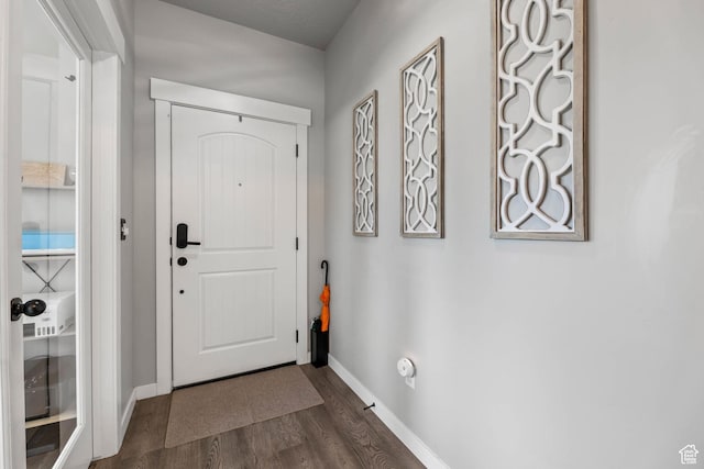 7886 N Bridleway Rd, Eagle Mountain, UT 84005 - entrance foyer featuring dark wood finished floors and baseboards