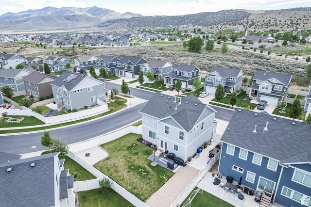 7886 N Bridleway Rd, Eagle Mountain, UT 84005 - aerial perspective of suburban area with a mountainous background