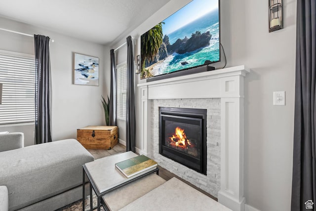 7886 N Bridleway Rd, Eagle Mountain, UT 84005 - living area with a fireplace and wood finished floors