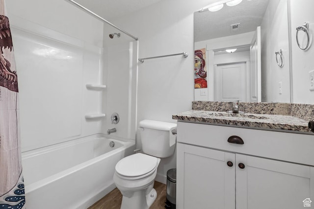 7886 N Bridleway Rd, Eagle Mountain, UT 84005 - bathroom with vanity, toilet, shower / tub combo, wood finished floors, and a textured ceiling