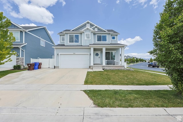 7886 N Bridleway Rd, Eagle Mountain, UT 84005 - view of front facade with a porch, driveway, and an attached garage