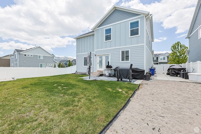 7886 N Bridleway Rd, Eagle Mountain, UT 84005 - rear view of property with board and batten siding, a patio area, entry steps, and french doors