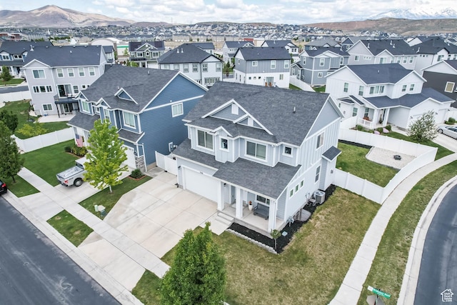 7886 N Bridleway Rd, Eagle Mountain, UT 84005 - aerial perspective of suburban area with a mountain backdrop