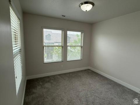 6396 W Sugarcane Dr W Unit 345, South Jordan, UT 84009 - carpeted empty room with baseboards