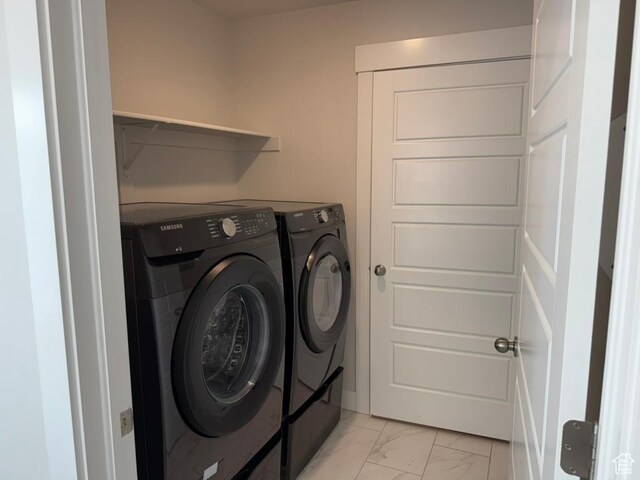 6396 W Sugarcane Dr W Unit 345, South Jordan, UT 84009 - laundry room featuring washing machine and clothes dryer and light marble finish floors