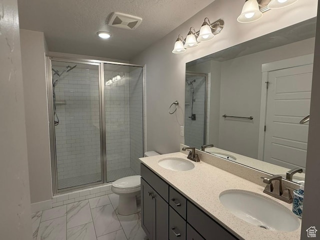 6396 W Sugarcane Dr W Unit 345, South Jordan, UT 84009 - full bathroom featuring a shower stall, toilet, marble look tiles, and a textured ceiling