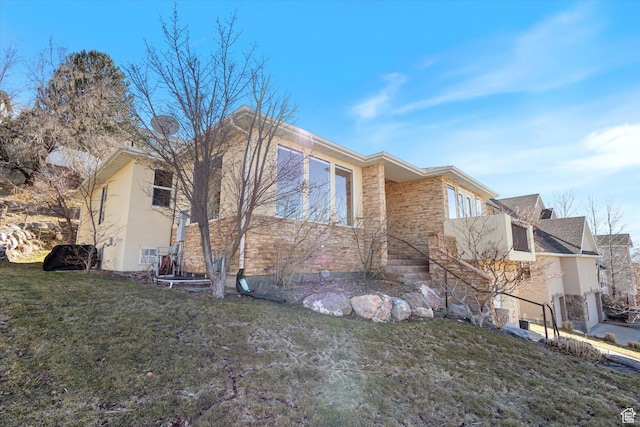 442 E Brew Rd, Draper, UT 84020 - view of property exterior featuring a lawn and stucco siding