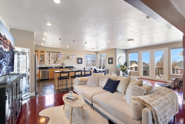442 E Brew Rd, Draper, UT 84020 - living room featuring recessed lighting, dark wood-style flooring, a textured ceiling, and baseboards