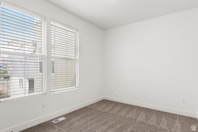 4584 W Daybreak Rim Way S, Jordan, UT 84009 - empty room featuring carpet flooring and baseboards