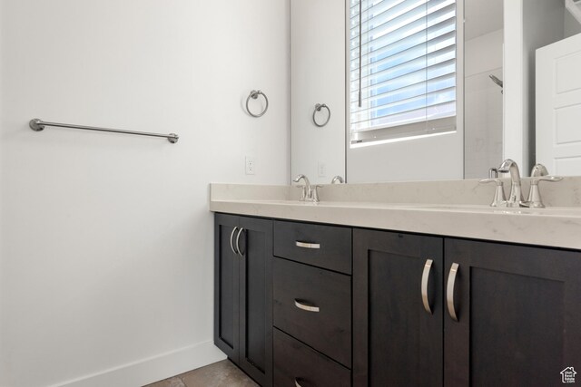 4584 W Daybreak Rim Way S, Jordan, UT 84009 - full bathroom with double vanity, baseboards, and tile patterned flooring