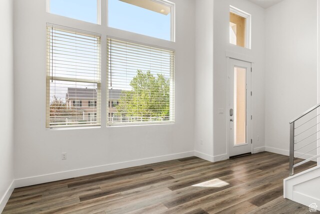 4584 W Daybreak Rim Way S, Jordan, UT 84009 - foyer entrance featuring healthy amount of natural light, wood finished floors, baseboards, stairway, and a towering ceiling