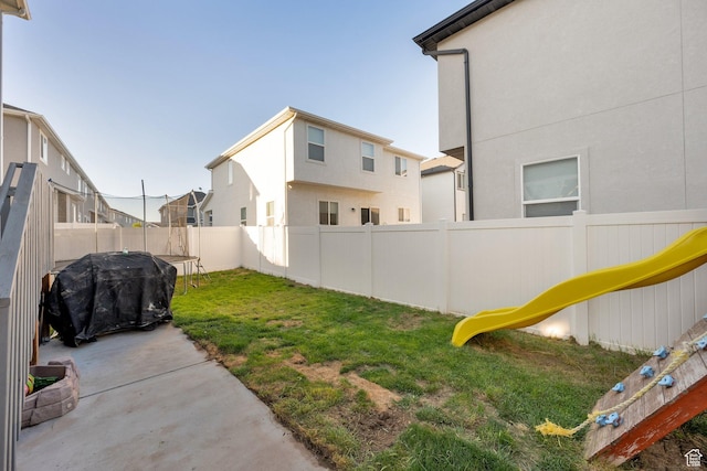 7208 N Silver Spring Way, Eagle Mountain, UT 84005 - view of yard with a trampoline and a patio