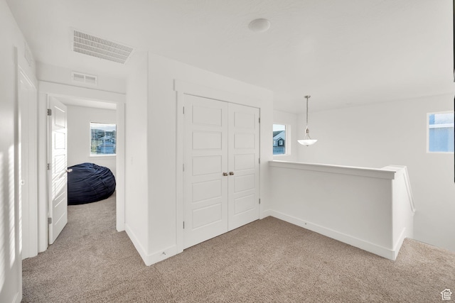7208 N Silver Spring Way, Eagle Mountain, UT 84005 - unfurnished bedroom featuring carpet flooring, multiple windows, a closet, and baseboards
