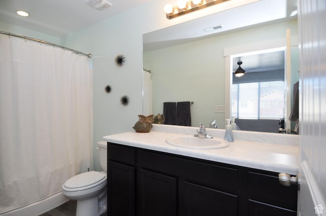 5213 W Courtly Ln, Herriman, UT 84096 - bathroom featuring vanity, toilet, ceiling fan, and shower / bath combo with shower curtain