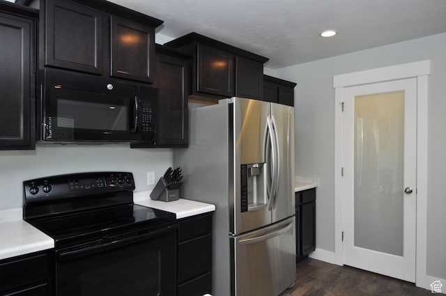 5213 W Courtly Ln, Herriman, UT 84096 - kitchen featuring black appliances, light countertops, dark wood finished floors, recessed lighting, and dark cabinets