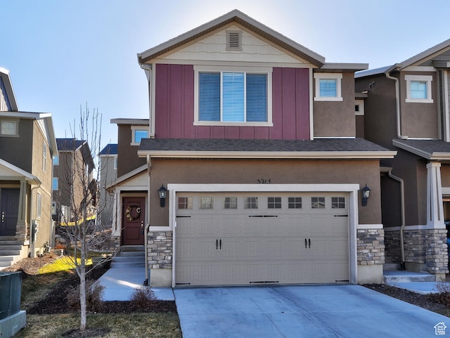 5213 W Courtly Ln, Herriman, UT 84096 - view of front of house with stone siding, an attached garage, driveway, and board and batten siding